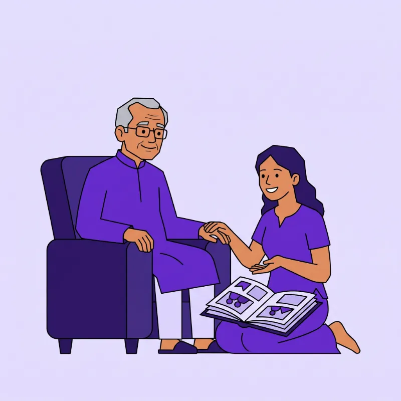 A daughter showing a family photo album to her elderly father